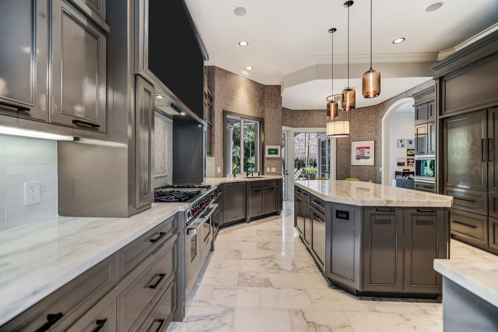 Kitchen looking along the marble counters toward the garden doors