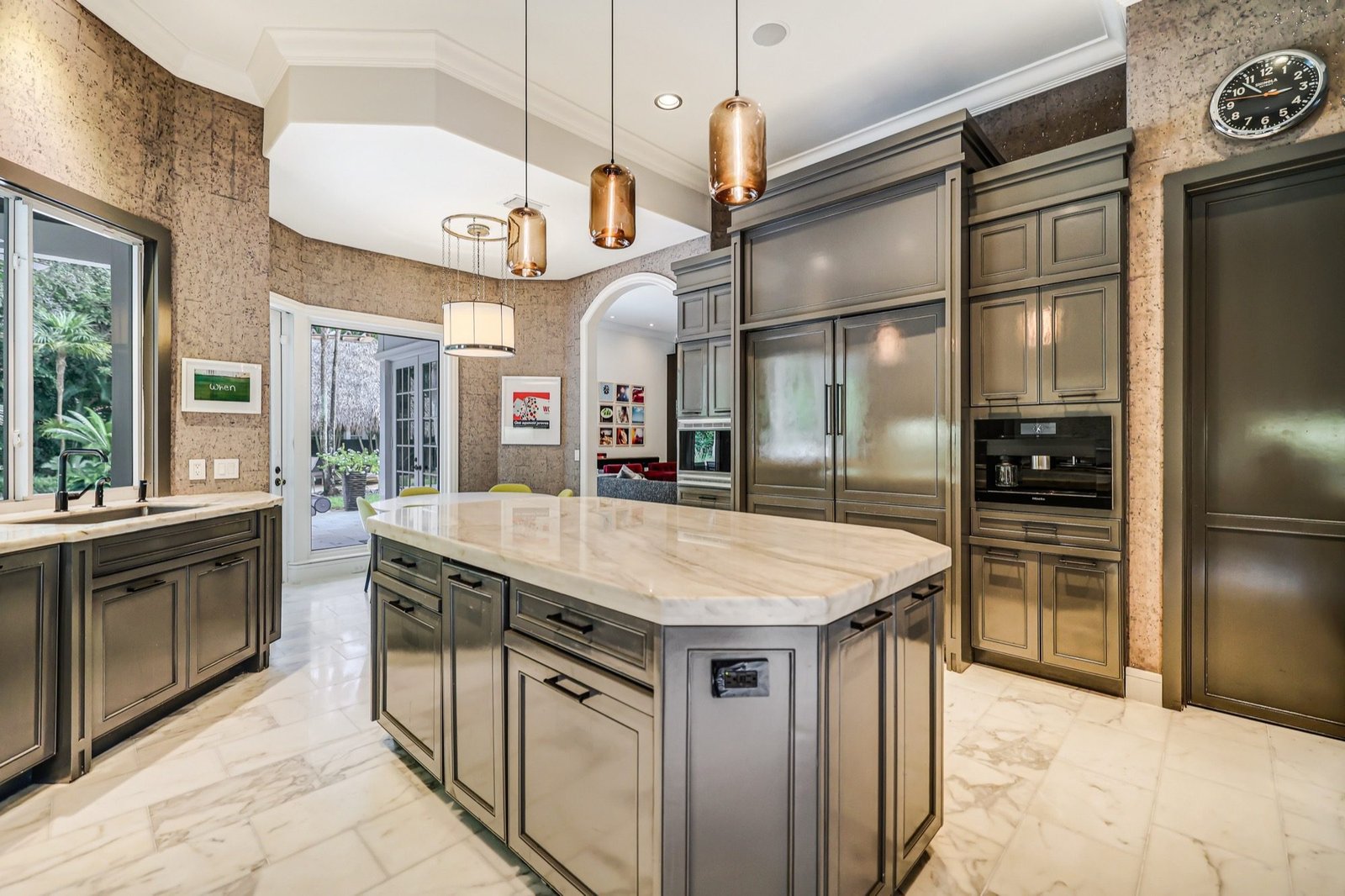 Kitchen island with Sub-Zero and Miele appliances behind