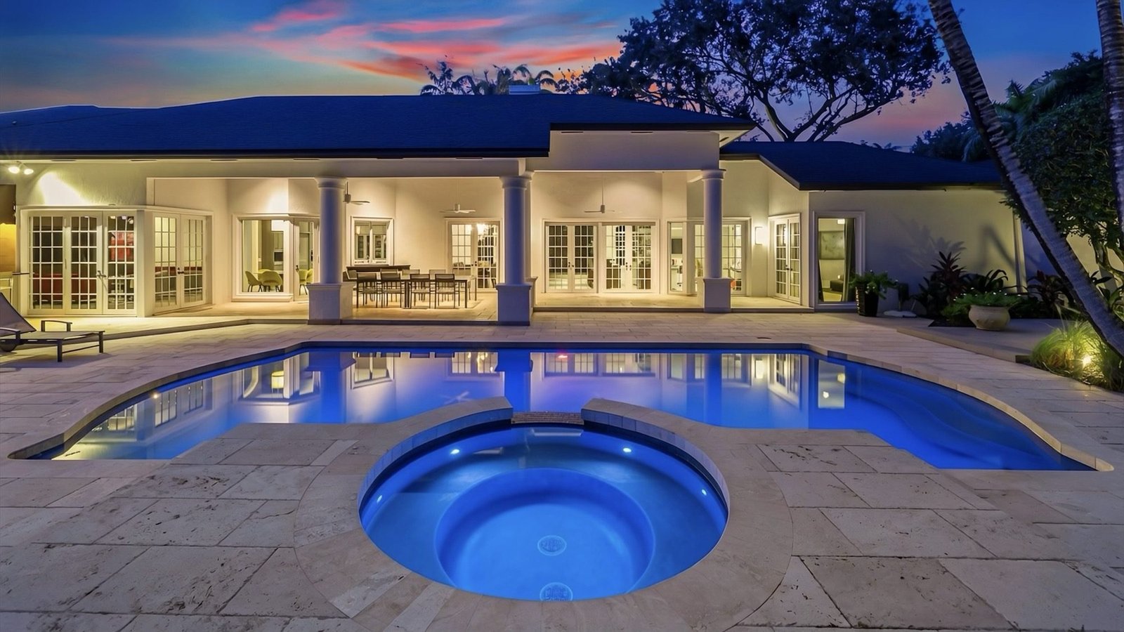 Pool and circular spa facing the rear elevation and covered terrace